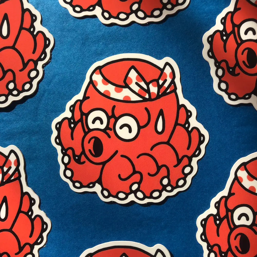 Takotaro is one of our original characters. It is inspired by the mascots that can be found on the front of takoyaki stands, these small dumplings filled with octopus.
The name Takotaro is composed of the Japanese word “tako” which means “octopus” and the suffix “taro” which means “eldest son” and which is added to many Japanese names.
• Vinyl sticker
• 3.8x9 cm
• PVC free
• Anti-UV varnish
• Can be used outside
• Printed in Sweden