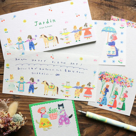 Assorted letter and stationery sets including Japanese mini letter papers, envelopes, cute animal designs, floral stationery, and premium writing sets.