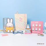 Every day's a little brighter with Miffy by your side! This 17-month planner (Aug. 2026–Dec. 2027) features weekly planning pages filled with adorable Miffy artwork, plus extra notes pages, a two-year reference calendar, and a holiday list—everything you need to stay organized and inspired all year. 

• 7.5"w × 8.5"h 
• 17 months (Aug. 2026–Dec. 2027) 
• 160 pages; 100 gsm acid-free FSC®-certified paper 
• Softcover; Twin-ring wire-o binding 

© Mercis bv
