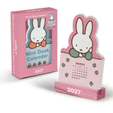Welcome the new year with this adorable Miffy Desk Calendar (Jan.–Dec. 2027). Each month is printed on a sturdy, die-cut card featuring the iconic bunny in pastel colors and seasonal artwork. Place the current month on the included wooden stand for a sweet, simple calendar reference you’ll enjoy all year long.

• Box: 3.75"w x 5.25"h 
• 12 months (Jan.–Dec. 2027) 
• 13 sheets; 300 gsm acid-free, FSC®-certified paper 
• Shrink-wrapped in paper box 
• Includes sturdy wood stand 

© Mercis bv