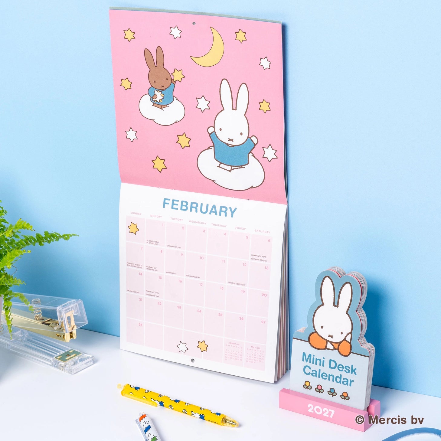 Welcome the new year with this adorable Miffy Desk Calendar (Jan.–Dec. 2027). Each month is printed on a sturdy, die-cut card featuring the iconic bunny in pastel colors and seasonal artwork. Place the current month on the included wooden stand for a sweet, simple calendar reference you’ll enjoy all year long.

• Box: 3.75"w x 5.25"h 
• 12 months (Jan.–Dec. 2027) 
• 13 sheets; 300 gsm acid-free, FSC®-certified paper 
• Shrink-wrapped in paper box 
• Includes sturdy wood stand 

© Mercis bv