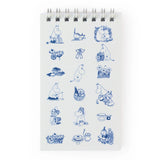 Inspired by Tove Jansson’s beloved world, this collection celebrates the beauty of a slower, gentler way of living where simple pleasures like a warm cup of tea, a quiet walk, and time spent with friends mean everything. Each piece reflects the spirit of Moominvalley: thoughtful, whimsical, and rooted in everyday joy.