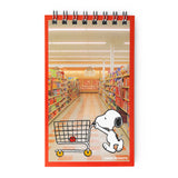 A nostalgic nod to the stationery aisle—those tiny spiral notebooks you’d flip through while your mom checked out at the local five-and-dime. These vintage-style memo pads are straight out of the 1980s, reimagined with photo-real backgrounds and everyone’s favorite beagle doing what he does best: being adorable.