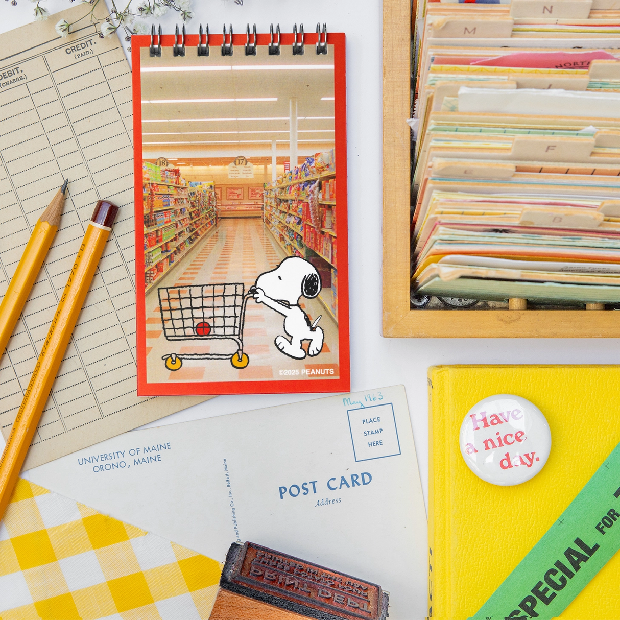 A nostalgic nod to the stationery aisle—those tiny spiral notebooks you’d flip through while your mom checked out at the local five-and-dime. These vintage-style memo pads are straight out of the 1980s, reimagined with photo-real backgrounds and everyone’s favorite beagle doing what he does best: being adorable.
