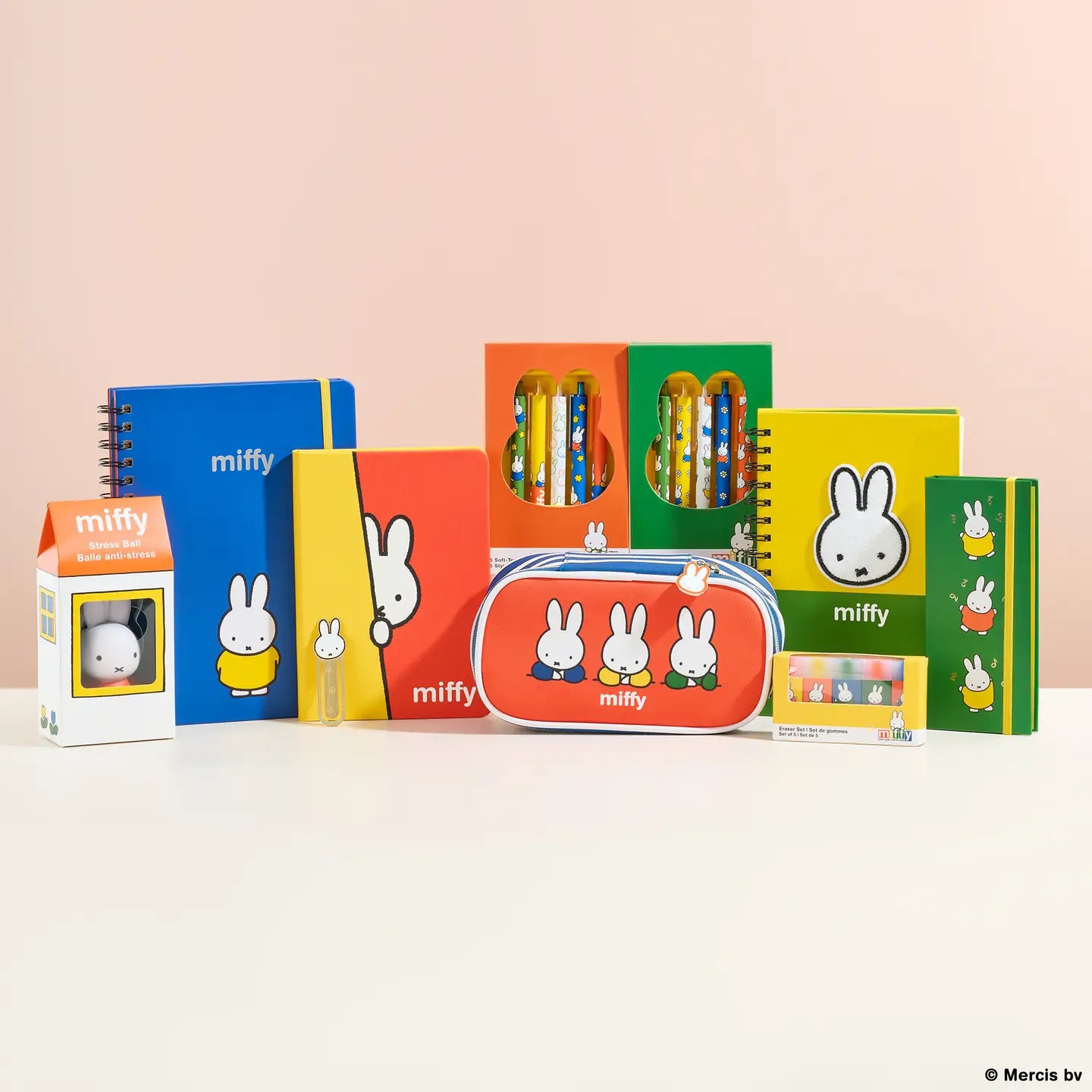 Brighten up your desk and let your creativity flow with this adorable Soft-Touch Gel Pen Set! Packed with five smooth-writing, multicolor gel pens, each one features sweet Miffy artwork and a soft-touch coating for an extra comfy grip. The pens come in a charming die-cut box with a slide-out tray and a playful ribbon pull, complete with a Miffy-shaped cutout for an irresistibly cute display. Whether you're jotting notes, doodling, or gifting to a friend, this set adds a splash of fun and color to every page