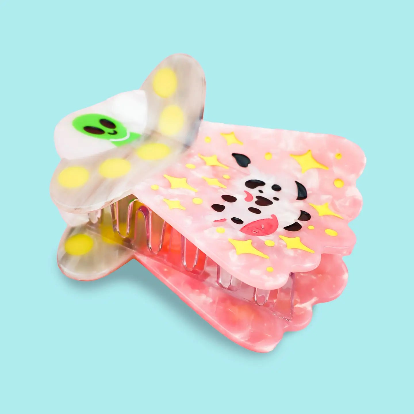 Alien UFO Hair Claw' Hair Accessory by Turtle's Soup.

Includes one (1) hair claw
Claw is roughly 3"
3D, engraved, printed, and painted details
High quality acetate material, stronger than standard hair clips
Themed packaging