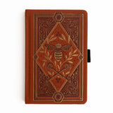 Let your creativity buzz with warmth and intention. The Keeper of the Bees Notebook in Rust blends golden honeybee symbolism with rich, earthy tones, creating a journal that feels both enchanting and grounding. Perfect for capturing ideas, documenting your days, or exploring your imagination—this notebook turns every page into a moment of magic.