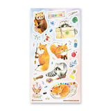  @yuhuirustudio’s woodland artists have traded the forest floor for a table full of paints, brushes, wax seals, and colorful little treasures! A fox holds its favorite brush, a red panda chooses the perfect shade, and one sleepy helper has decided a watercolor palette makes an excellent place for a nap.

Art by: @yuhuirustudio


One sticker sheet is included.
Top Coating: None
Adhesive Layer: Paper
Backing Layer: Paper
Size: 6.69"x3.54"
Weight-0.03oz