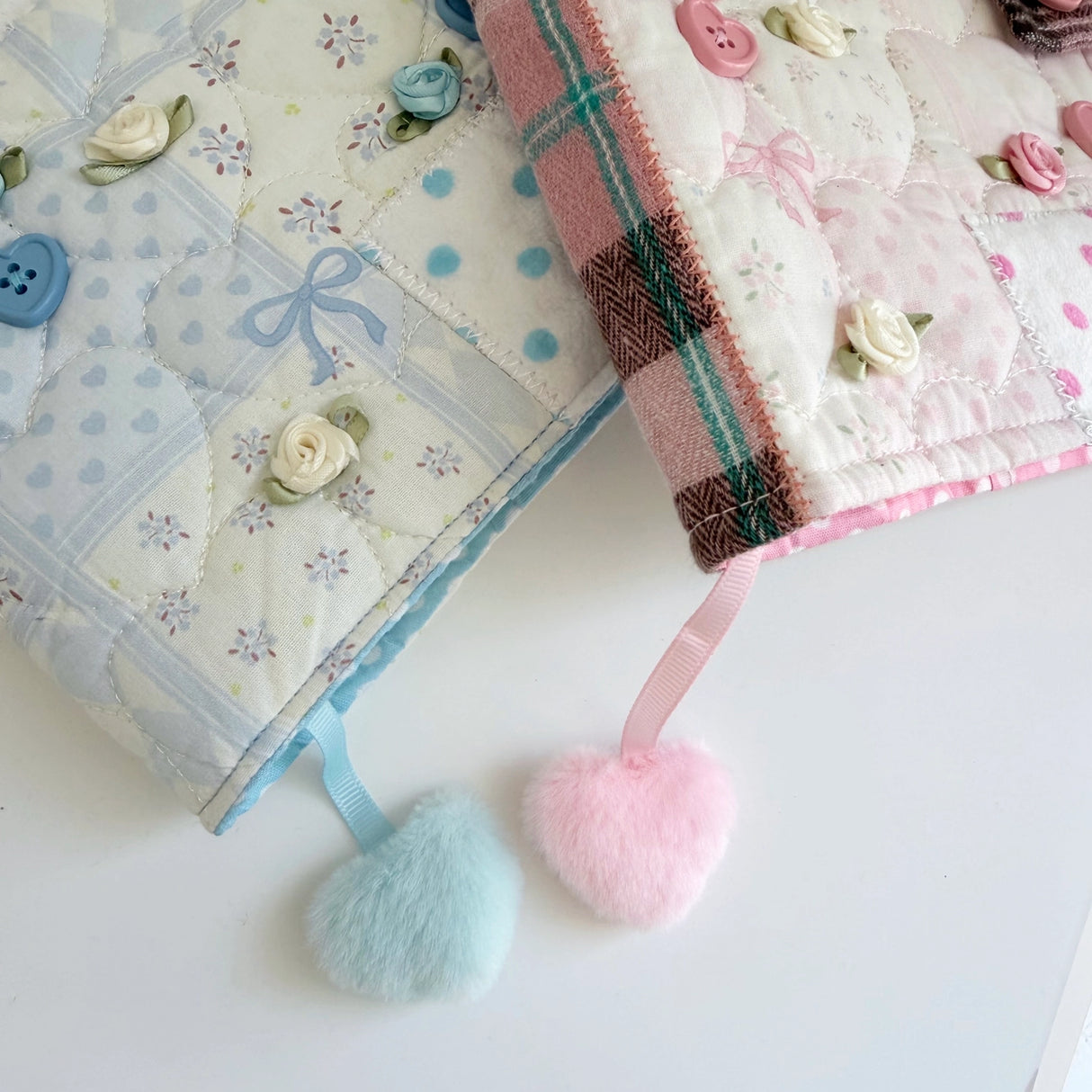 Elevate your journaling experience with these soft and cozy journal covers, designed to protect and personalize your daily diary. Each cover features beautiful blue and pink patterned fabric with thoughtfully sewn details and a secure metal button clasp to keep your pages safe. Includes matching ribbon bookmarks for easy navigation. Available in both A5 and A6 sizes to fit your preferred journal dimensions. The perfect companion for your daily routine and creative practice.