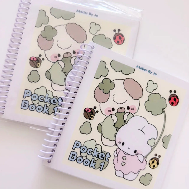 Cozy Creativity Anywhere with the Atelier by Jo Pocket Coloring Book! ✨

Bring Cotton and Pluto along on your everyday adventures with this adorable Pocket Coloring Book featuring simple and cozy Atelier by Jo character pages! Filled with 20 original illustrations in a compact 4 x 5 inch format, this spiral-bound mini coloring book is designed for relaxing, stress-free coloring anytime and anywhere.

Featuring sweet character moments, cute everyday scenes, and easy-to-color designs, this collection is perfe