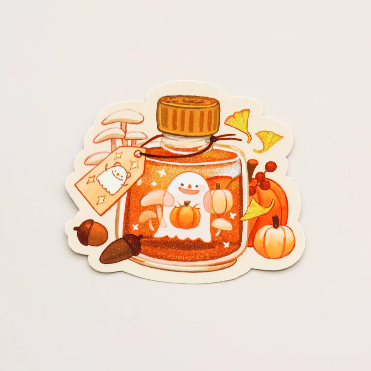 Sticker with a glass bottle of honey, ghost, and pumpkin design on a light gray background