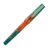 BENU presents the newest Haute Collection — a line of elegant, fashion-inspired pens that blend classic charm with bold, modern flair. The designs include both subtle and vibrant styles, showcasing BENU’s signature glitter and color artistry. Each pen features a faceted body with alternating wide and slender facets, complemented by either gold-plated or chrome-plated trims for a sleek, timeless look.

With a bold orange and teal body streaked with gold, Chic turns heads with runway-ready style. Fashion-forw