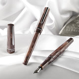 BENU presents the newest Haute Collection — a line of elegant, fashion-inspired pens that blend classic charm with bold, modern flair. The designs include both subtle and vibrant styles, showcasing BENU’s signature glitter and color artistry. Each pen features a faceted body with alternating wide and slender facets, complemented by either gold-plated or chrome-plated trims for a sleek, timeless look.

With smoky gray marbling and polished chrome hardware, Satin is the essence of modern elegance. Understated
