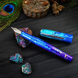 BENU Talisman Fountain Pen - Peacock Ore

Peacock Ore, with its spectacular iridescent tarnish effect, is one of nature’s most colorful minerals. Those who believe in the healing powers of crystals call it the “stone of happiness”. Believed to head us in positive directions and help channel happiness onto others, crystal enthusiasts claim this to be a truly uplifting stone.&nbsp;

Drawing inspiration from certain tales of yore, we set out to convey these stories not only in the color and style of each pen, 