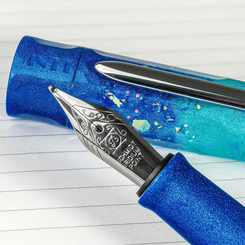BENU Talisman Fountain Pen - Peacock Ore

Peacock Ore, with its spectacular iridescent tarnish effect, is one of nature’s most colorful minerals. Those who believe in the healing powers of crystals call it the “stone of happiness”. Believed to head us in positive directions and help channel happiness onto others, crystal enthusiasts claim this to be a truly uplifting stone.&nbsp;

Drawing inspiration from certain tales of yore, we set out to convey these stories not only in the color and style of each pen, 
