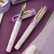 BENU Talisman Fountain Pen - Pink Opal

Inspired by the soft beauty and symbolism of the Pink Opal stone, Pink Opal joins BENU’s Talisman Collection — a series dedicated to legendary substances, natural materials, and symbols believed to carry meaning, protection, or good fortune across cultures and history.


The design captures the delicate character of pink opal through a palette that shifts between gentle cotton pink and soft lavender tones. Pronounced pearlescent effects and light-shifting properties c
