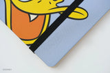 This medium notebook includes 160 pages of 100GSM blank paper and a matte hardcover featuring Donald Duck and Daisy Duck. It also has a built-in pencil holster that comes loaded with a Donald Duck Blackwing pencil.