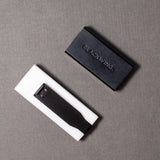We took the iconic design of our eraser clip and adapted it into a sleek handheld form that feels great to use.

The eraser is made of a special soft material that erases the dark lines of our graphite cleanly and easily. The holder is made of durable aluminum that lets you get a solid grip while erasing. It also includes a jumbo-sized version of the iconic Blackwing clip, so you can extend the eraser as you use it.