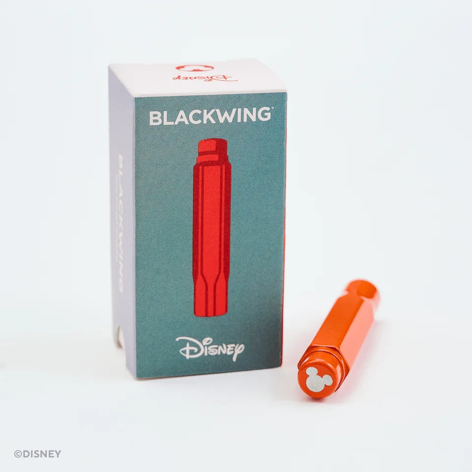 This red machined aluminum Point Guard is designed to make sure your Blackwing pencil stays sharp while you’re on the go. It features a silver Mickey Mouse emblem on the top. The tip of your pencil “floats” inside the cap to protect your point against unexpected drops or jams.