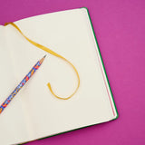 Volume 143 is our tribute to Frida Kahlo. The model number 143 is a nod to the 143 paintings commonly attributed to her over the course of her life.

This limited-edition Volume 143 Notebook features a cover design inspired by Frida's iconic imagery. Each limited-edition A5 (148 x 210 mm) medium notebook includes 160 pages of 100 GSM Blank paper, and a Vol. 143 pencil loaded in the pencil holster.

Limited-edition A5 medium notebook (148 x 210 mm)
160 pages of Blank paper
Includes Vol. 143 pencil