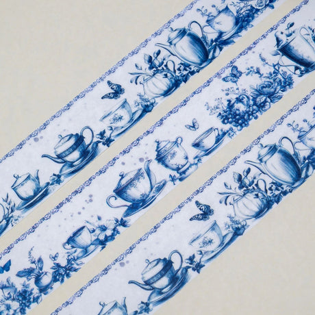 A unique vintage style washi tape featuring some dreamy tea party inspired blue patterns on a white background. Size: 2cm x 10m