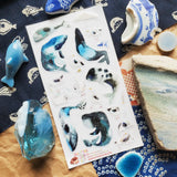 🐋☂️ Breezy and full of seaside charm, @martyna.czub’s watercolor whales and gulls make quite the charming coastal crew. With curious expressions, tiny umbrellas, rain boots, and a few delightfully dramatic whale poses, this playful sheet perfectly captures the magic of a windswept day by the sea.

Art by: @martyna.czub
