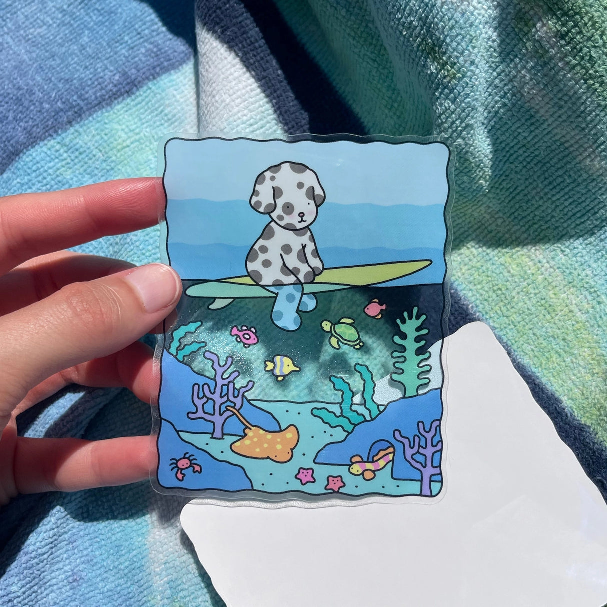 Bobbie Goods Vinyl Sticker - Underwater

Blue water in the middle is see-through!
Weatherproof
Gloss finish
3" x 3.7"