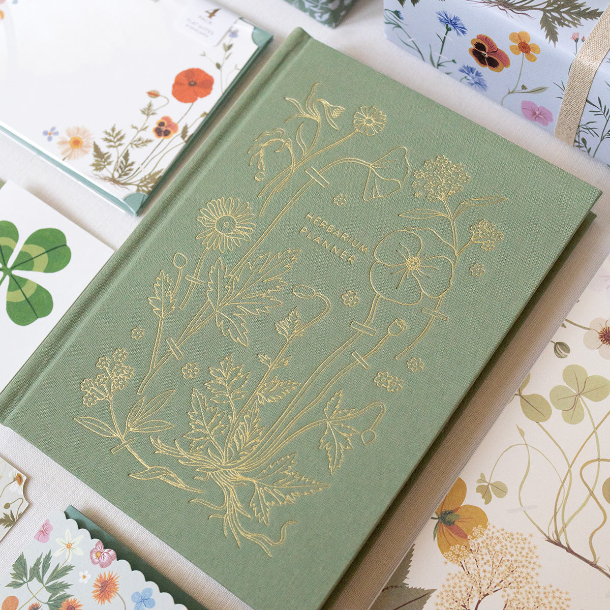 Hand-illustrated luxurious undated planner&nbsp;

Size: 6.25"x 8.5" x 0.75"

&nbsp;Lay-flat binding
Cover printed in full color and gold foil stamped
Matte gold foil-gilded edges ~ Full-color Book linen cloth
Illustrated inner pages
2 satin bookmarks
120 gsm natural white interior pages
Back pocket
Undated with room for 12 months
Birthdays and Special events spread
Monthly view located at the start of each month.
Weekly view
Notes pages