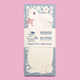 The sweetest little bunny is ready to hold your sweetest notes. Ditsy polka dots and a spray of little white flowers frame the white rabbit. Risograph printed in federal blue and light mauve.