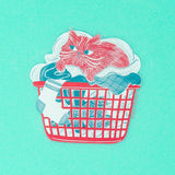 Is there anything cozier that curling up in a basket of warm laundry? This 3" clear sticker is purrfect for adorning water bottles, laptops, and more.