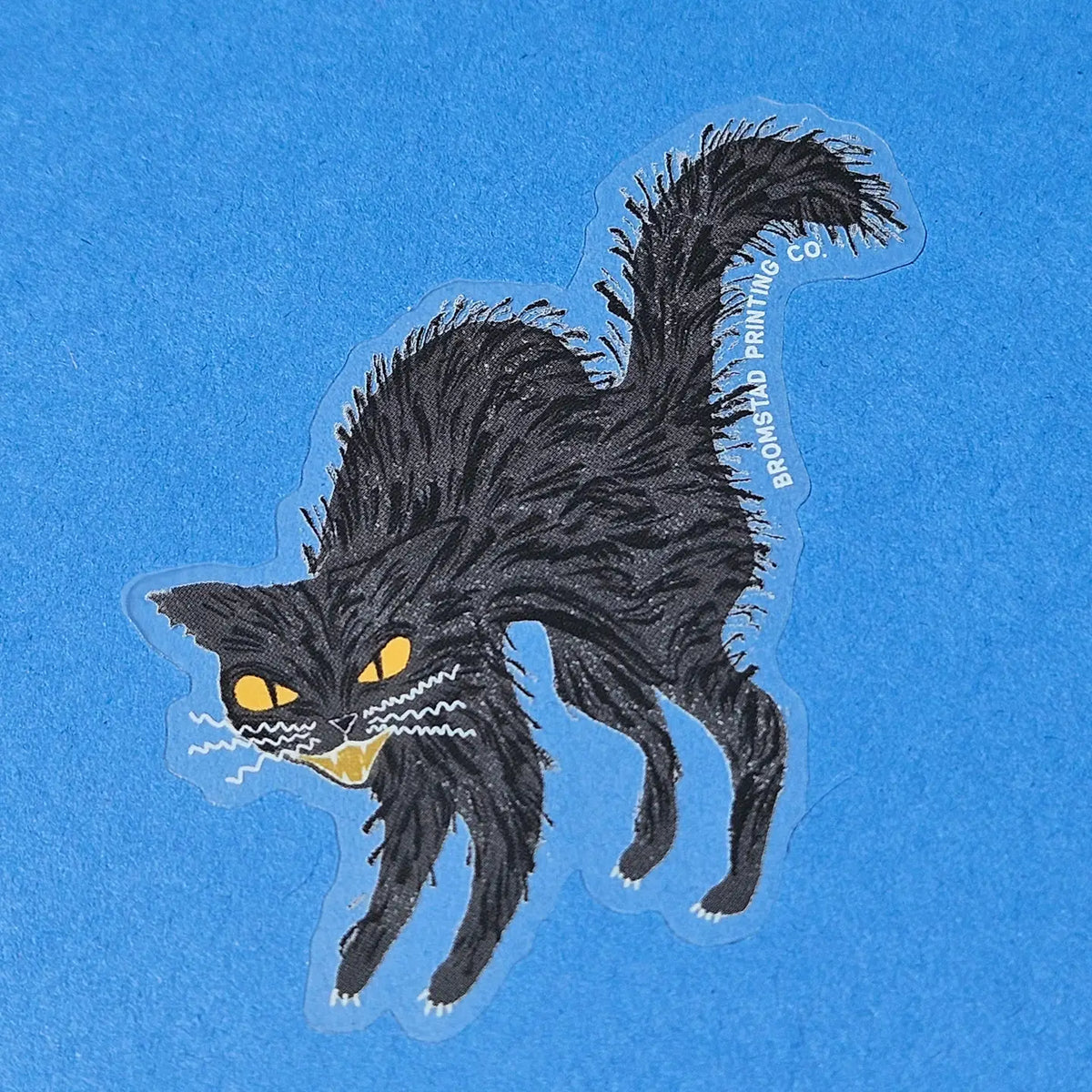 Hisss! Watch out for this Halloween black cat, all puffed up and showing its teeth! This 3" clear matte sticker is purrfect for adorning water bottles, laptops, and more.
