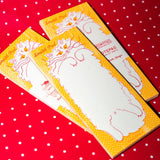 Beware the belly of this cat, you might get scratched as you scratch out your notes. Risograph printed in sunflower yellow and bright red with red glue on the top edge.
