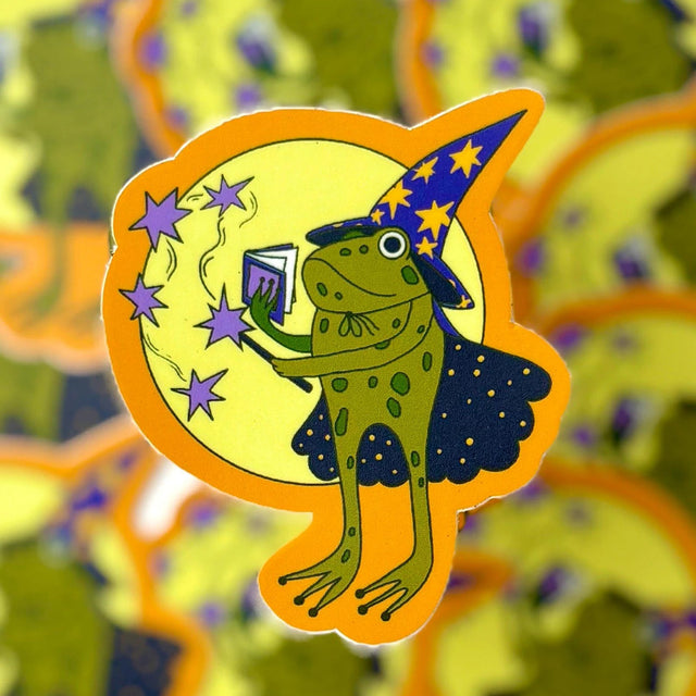 A whimsical little guy — this frog wizard is busy casting a spell.