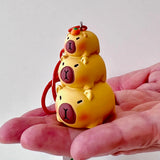 This adorable keychain adds personality wherever you go, whether clipped to your keys, bag, or backpack. Cute, lightweight, and easy to gift, it’s perfect for anyone who loves whimsical accessories or capybara-themed goodies.&nbsp;

Approx 2in x 2in
Includes 1 keychain&nbsp;