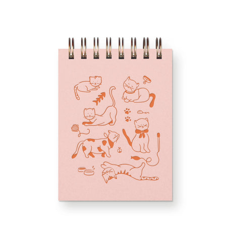 For the feline lover who knows cats rule because they're independent, chill, and furry soft. These playful purr balls are not only adorable but they want you to scribble down the name of that new treat or ideas for world domination, all inside the pages of this mini notebook.

Additional Details :

3”x4"
65 Unlined Interior Pages
Uncoated Vellum 70# Text Off-White Interior Paper
Bronze Wire-O Binding
Locally Made in Lawrence, Kansas