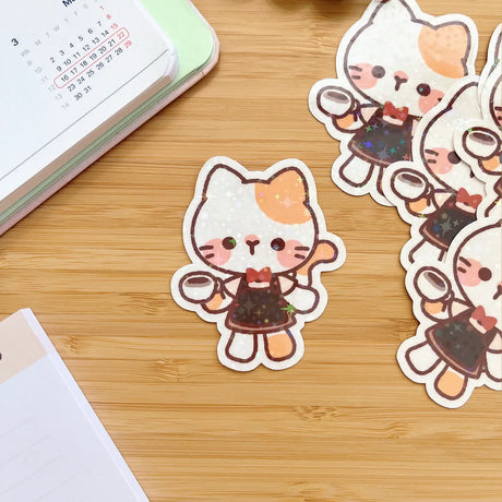 Decorate your laptop, notebook, planner, phone case, or just about anything that might need a little extra fun with this adorable Cafe Cat die-cut sticker.

Size: 50mm x 60mm

Material: Flitter Laminate&nbsp;

Waterproof

Includes 1 sticker