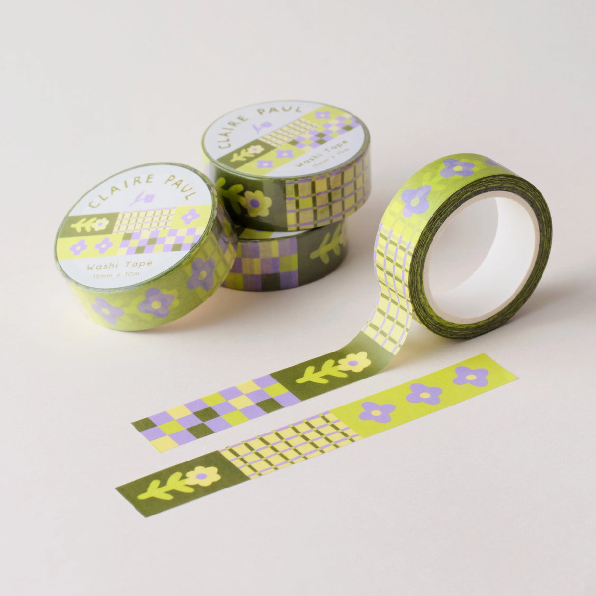 Flower Patch pattern washi tape! This tape featured illustrated florals, checkerboard and a grid pattern in a green, purple and cream colour palette.

This paper masking tape is perfect for decorating your bullet journal and planners, scrapbooking &amp; gift wrapping. It'll add some fun and colour to any surface and is easy to peel off.

10m x 15mm