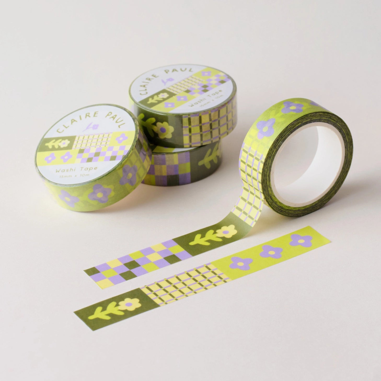 Flower Patch pattern washi tape! This tape featured illustrated florals, checkerboard and a grid pattern in a green, purple and cream colour palette.

This paper masking tape is perfect for decorating your bullet journal and planners, scrapbooking &amp; gift wrapping. It'll add some fun and colour to any surface and is easy to peel off.

10m x 15mm