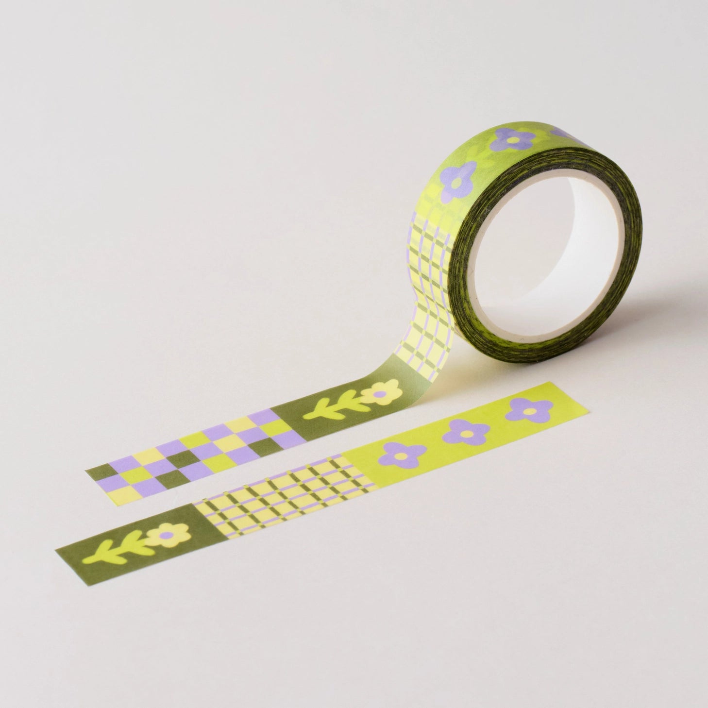 Flower Patch pattern washi tape! This tape featured illustrated florals, checkerboard and a grid pattern in a green, purple and cream colour palette.

This paper masking tape is perfect for decorating your bullet journal and planners, scrapbooking &amp; gift wrapping. It'll add some fun and colour to any surface and is easy to peel off.

10m x 15mm