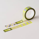 Flower Patch pattern washi tape! This tape featured illustrated florals, checkerboard and a grid pattern in a green, purple and cream colour palette.

This paper masking tape is perfect for decorating your bullet journal and planners, scrapbooking &amp; gift wrapping. It'll add some fun and colour to any surface and is easy to peel off.

10m x 15mm