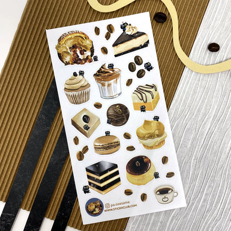 Someone somewhere decided coffee on its own wasn’t enough and a whole host of coffee-flavored sweeties were born! @pa.osesame ‘s little black cat loves them, and so do we.

Art by: @pa.osesame

Top Coating: None

Adhesive Layer: Paper

Backing Layer: Clear PET

6.69" x 3.54". Weight - 0.03lbs.

1 sheet included