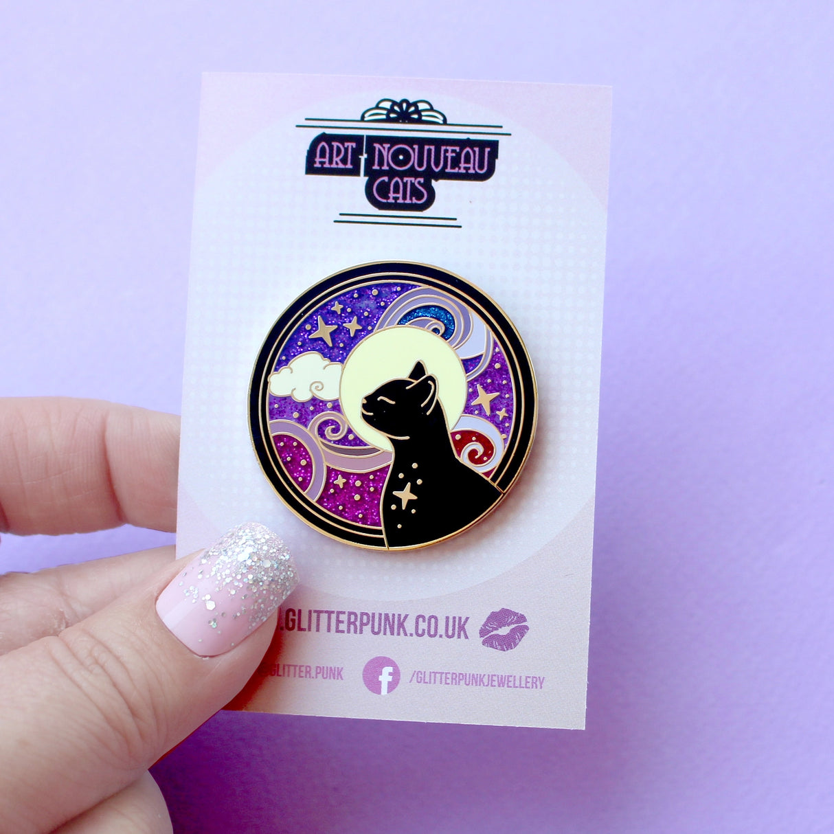 This amazing Cosmic Cat features a black cat against a celestial background, done in an Art Nouveau style. The purple and blue swirls are full of glitter – this fab pin is a real conversation starter!&nbsp;

The pin is secured by two purple heart backs and comes on a special ‘Art Nouveau’ Glitter Punk backing card, making it perfect for a gift or to keep as a special treat for yourself.

This pin is part of my Art Nouveau Cats collection – 8 enamel pins based on the fabulous 19th/20th century art movement.

