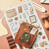 🍂📔 Little treasures for a beautifully creative day! @nicole_josephine’s charming sheet is filled with warm, nature-inspired stationery, from well-loved journals and taped-up photos to leafy keepsakes, tiny trinkets, and cozy desk essentials. This sheet feels like a quiet afternoon spent prettying a planner, documenting little moments, and tucking away memories for later.

Art by: @Nicole.josephine