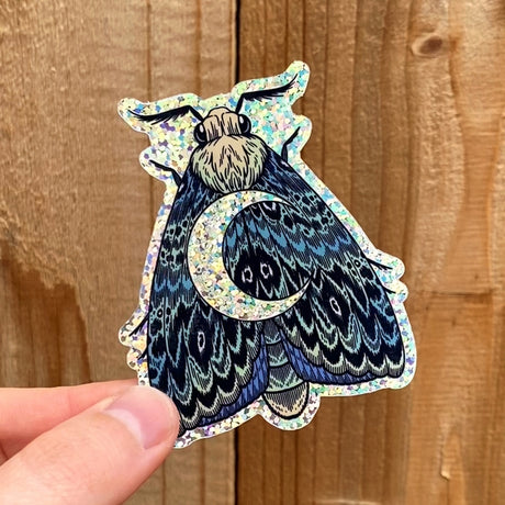 Pegatina con purpurina de polilla en forma de media luna