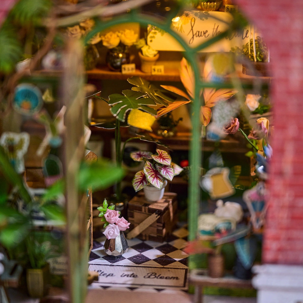 Step inside The Flower Shop, a cozy miniature haven where vibrant flower arrangements bloom in elegant vases, lush potted plants thrive, and fresh bouquets overflow with color. This delightful build features classic red brick walls, a welcoming wooden arched doorway, and a checkerboard floor that adds timeless charm.

2 AAA batteries required; batteries are not included.
Ages 14+
248 pieces
Assembled size: 4.53 x 3.94 x 7.4 inches