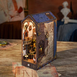 This miniature scene captures the soul of a Renaissance studio-arched windows filtering in warm light, a wooden easel displaying a half-finished sketch, parchment scrolls and notebooks scattered across a weathered worktable, and tools of invention and artistry tucked into every corner.&nbsp;

Illuminate your nook with a gentle tap on the touch-sensor power button. Or use the feature SMART SENSOR with a range of 20 inches, the LED light will seamlessly illuminate upon detection and gracefully fade out after 