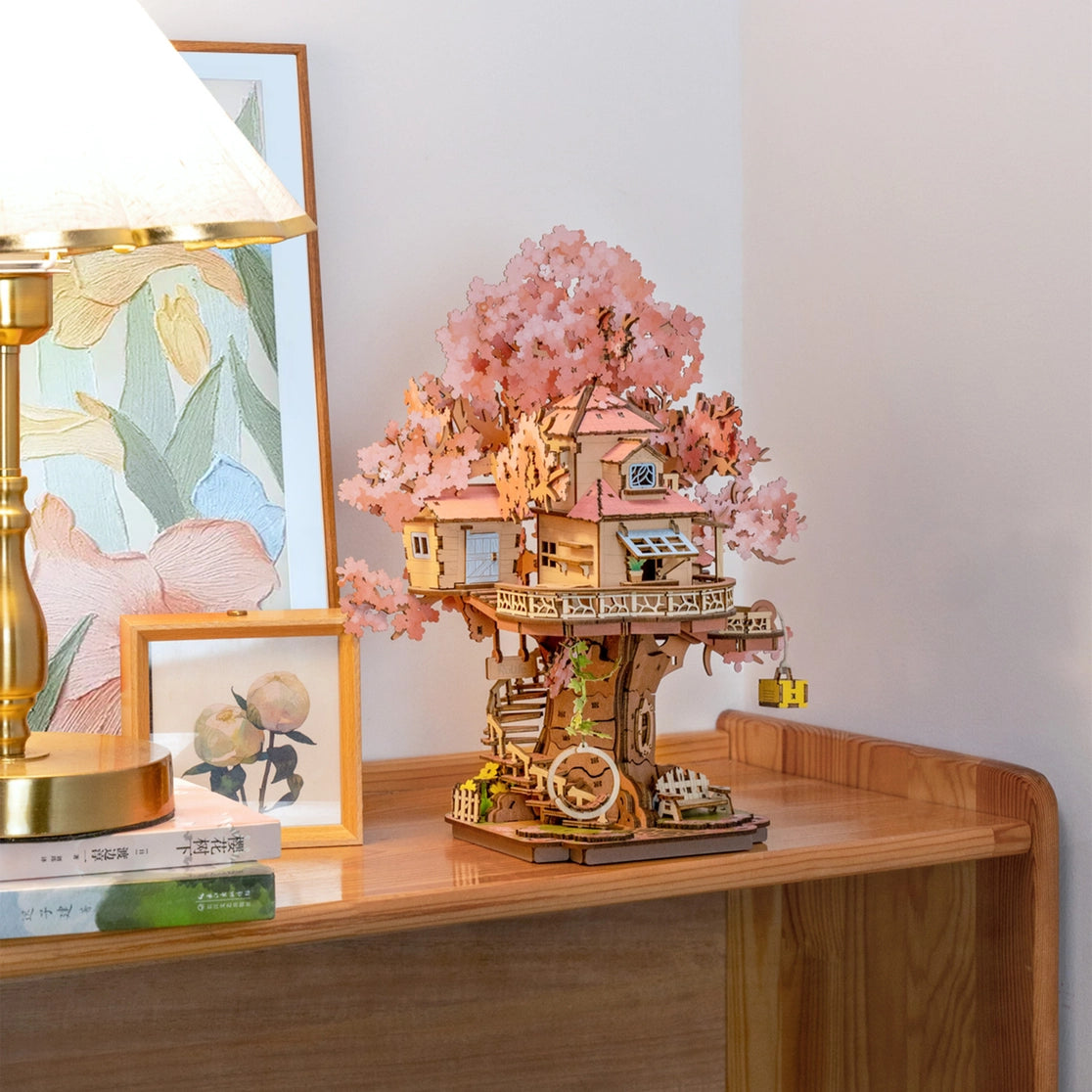 Craft a fairy sakura-scented retreat with this Rolife 3d puzzle! Delicate cherry blossoms, a swing, spiral stairs &amp; lift basket channel —no plastic, just soul-soothing wood. The miniature kit brings adventure fantasies to life.

535-piece 3d puzzle click snugly without glue—just gentle pressure! (no nail-breaking snaps!). Enjoy 5 hours of immersive, stress-relieving fun with the miniature kit. Perfect for unwinding after work or sharing quality time with family.
