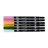 Set of 6 colors. Dual Brush Pens feature a flexible brush tip and a fine tip in one marker. The brush tip works like a paintbrush to create fine, medium, or bold strokes, while the fine tip provides consistent lines. The Teatime palette is inspired by elegant tea blends, featuring soft florals and earthy tones for a refined, calming aesthetic. The water-based ink is blendable, and the resilient nylon brush retains its point stroke after stroke. Colors include: Orchid (673), Mauve (817), Coral (873), Yellow 