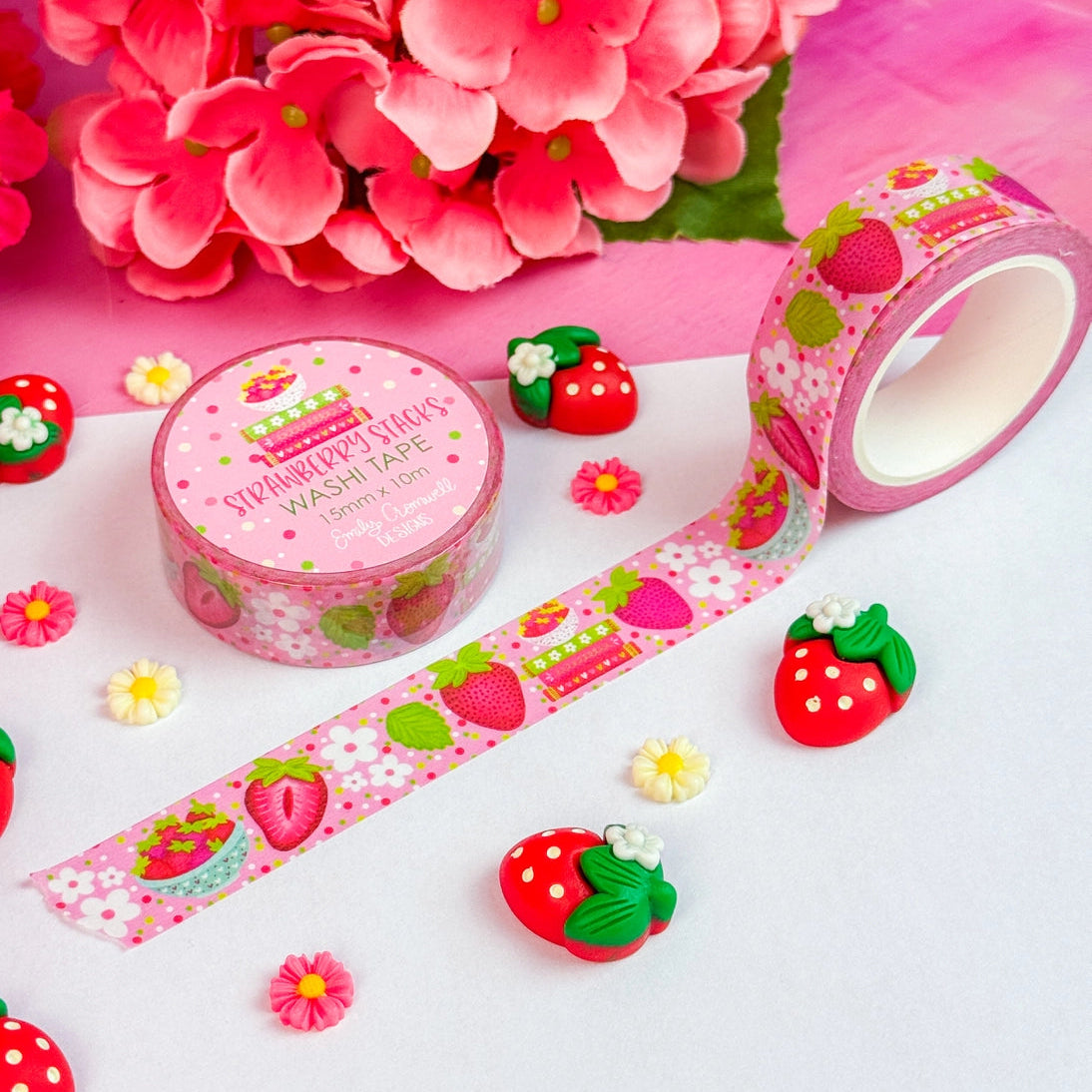 Add a pop of strawberry fun to your projects with our adorable Strawberry Stacks washi tape! Perfect for using in your planner, crafts, scrapbooking, and creative decorating, this cute washi tape sticks securely yet removes cleanly without damage.&nbsp;

Details:

Size: 15mm width x 10m length
Removable Washi Tape
Slightly Transparent
Features my hand drawn design as a repeat pattern