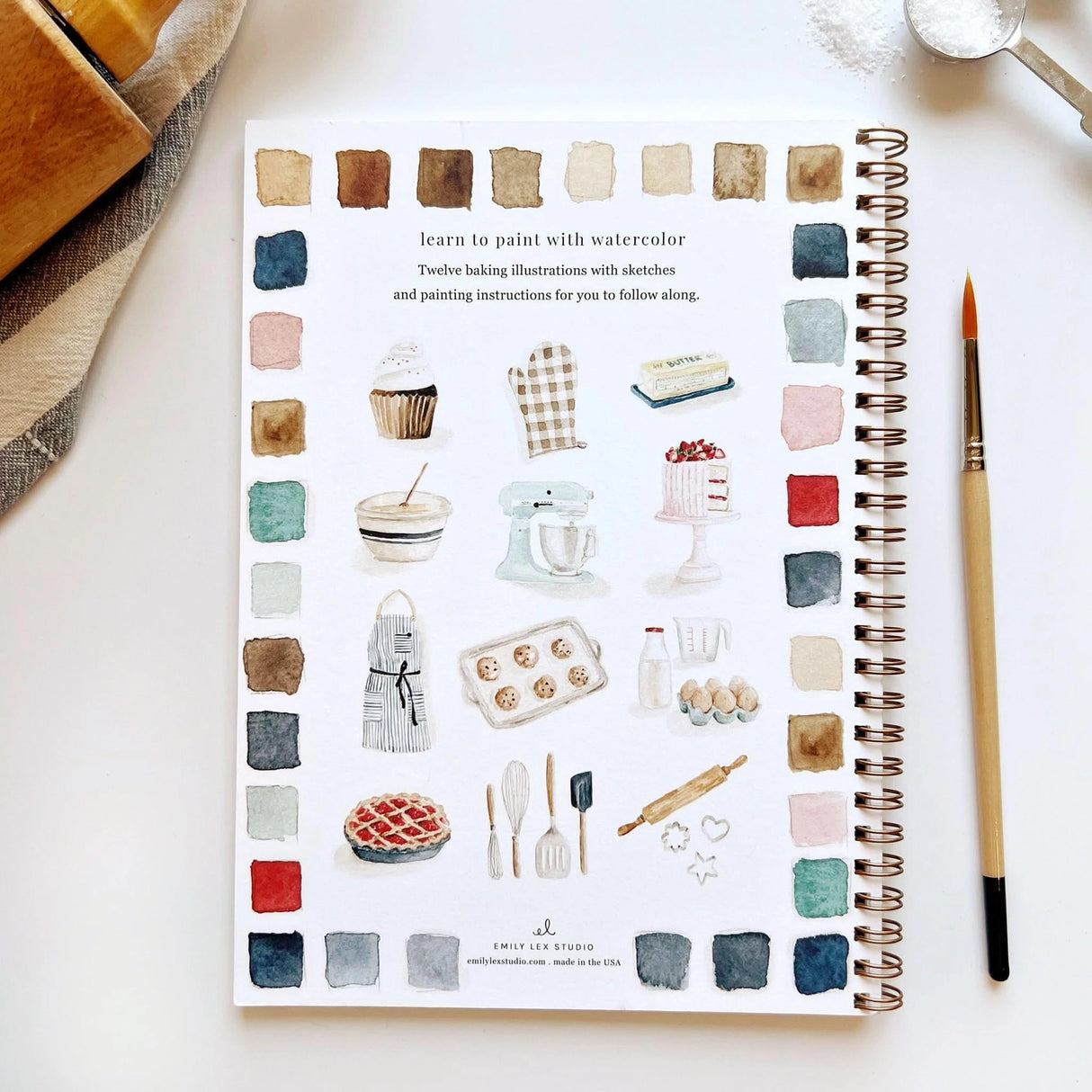 Emily Lex Studio Watercolor Workbook - Baking

Twelve baking illustrations — a cupcake, layer cake, mixing bowl, lattice pie, tray of cookies, rolling pin with cookie cutters, and more — each pre-outlined with step-by-step instructions. Paintings take about thirty minutes from start to finish, making it approachable for first-time painters and a favorite for gifting.

12 beginner-friendly illustrations
Thick 120lb watercolor paper&nbsp;
Lay-flat pages with spiral binding for hassle-free painting and easy te